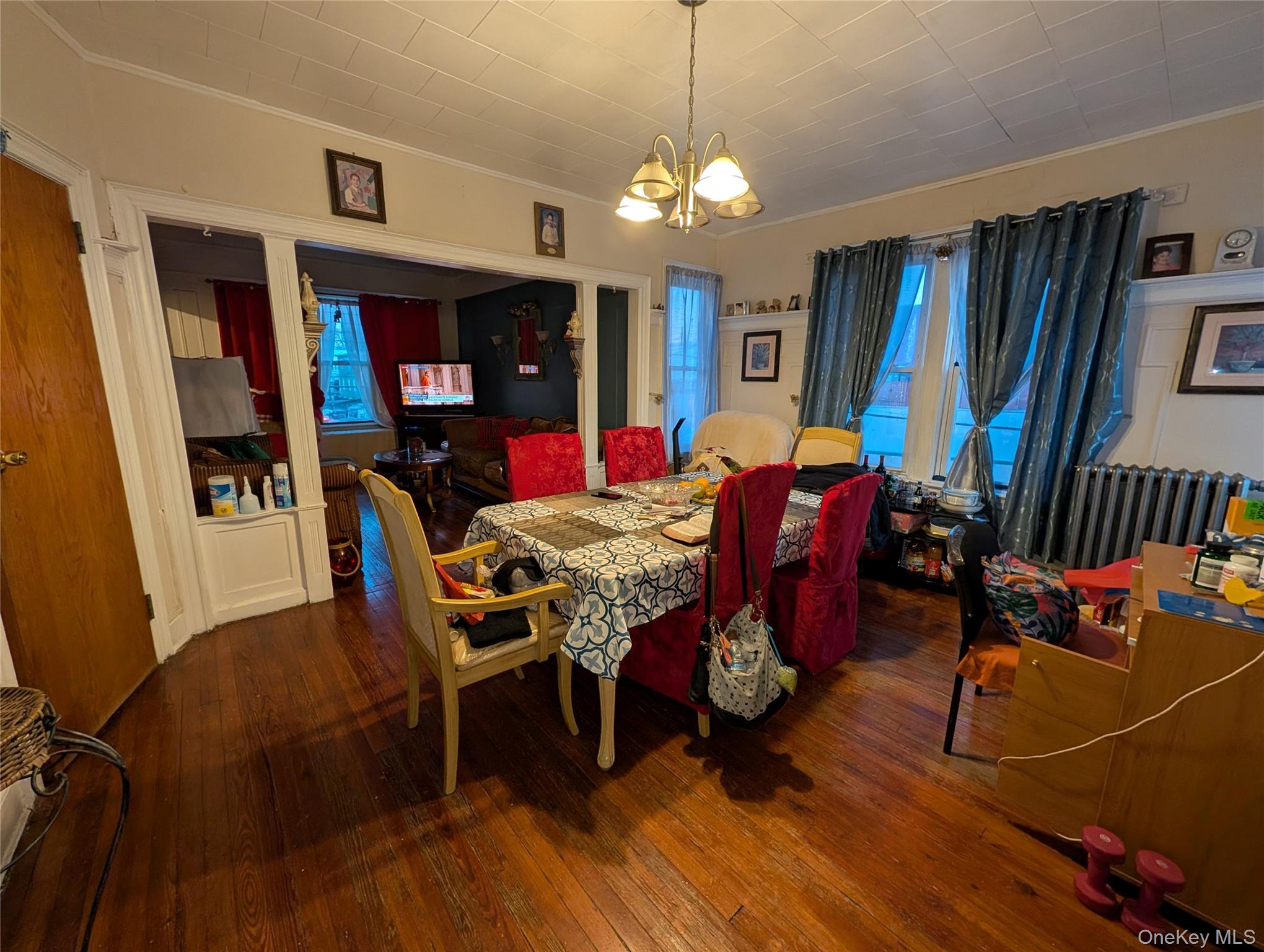 90-46 76th Street Queens, NY 11421 - Photo 22 of 32 a view of a dining room with furniture and chandelier