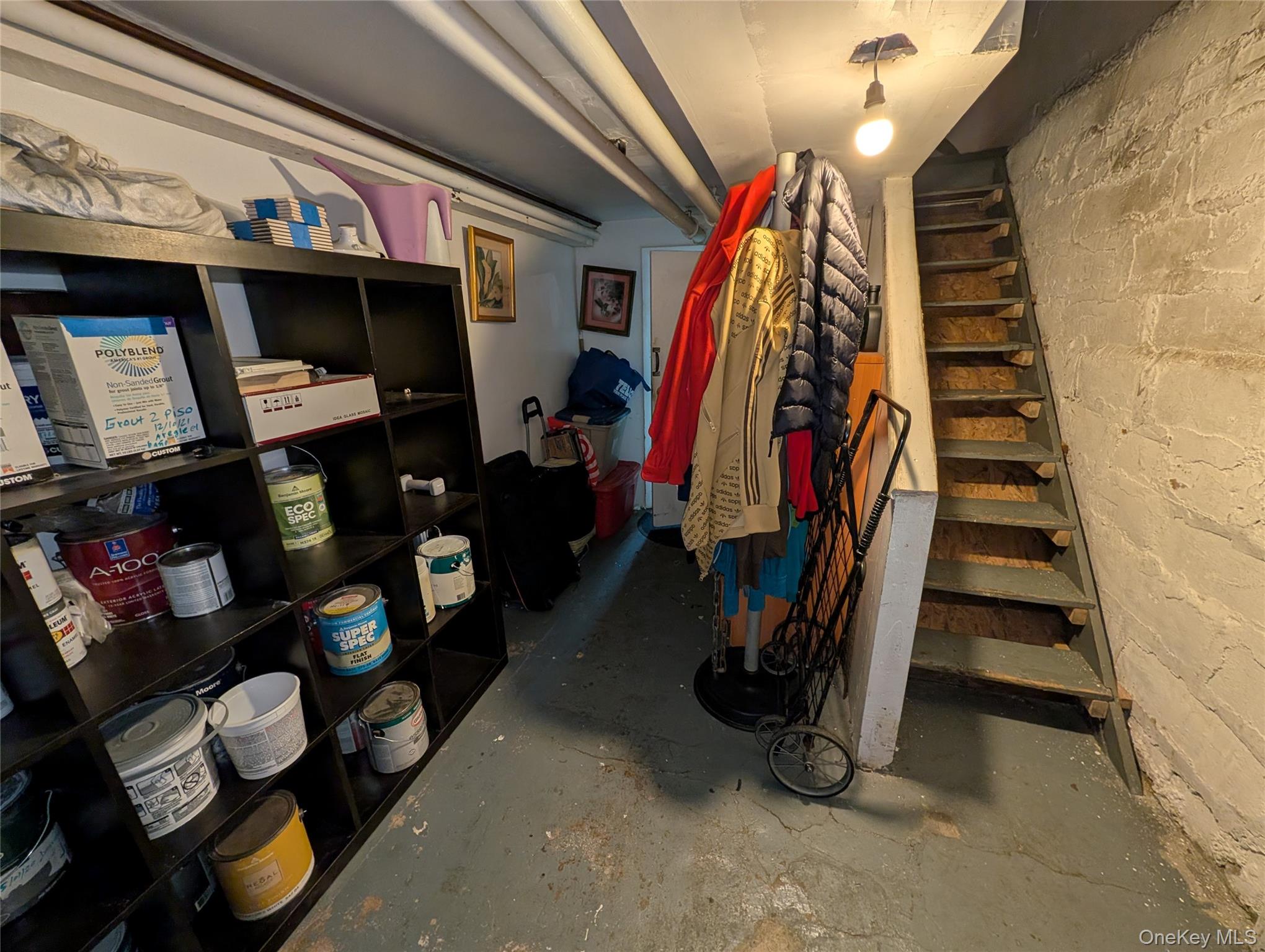 90-46 76th Street Queens, NY 11421 - Photo 23 of 32 a view of walk in closet with clothes and shoes