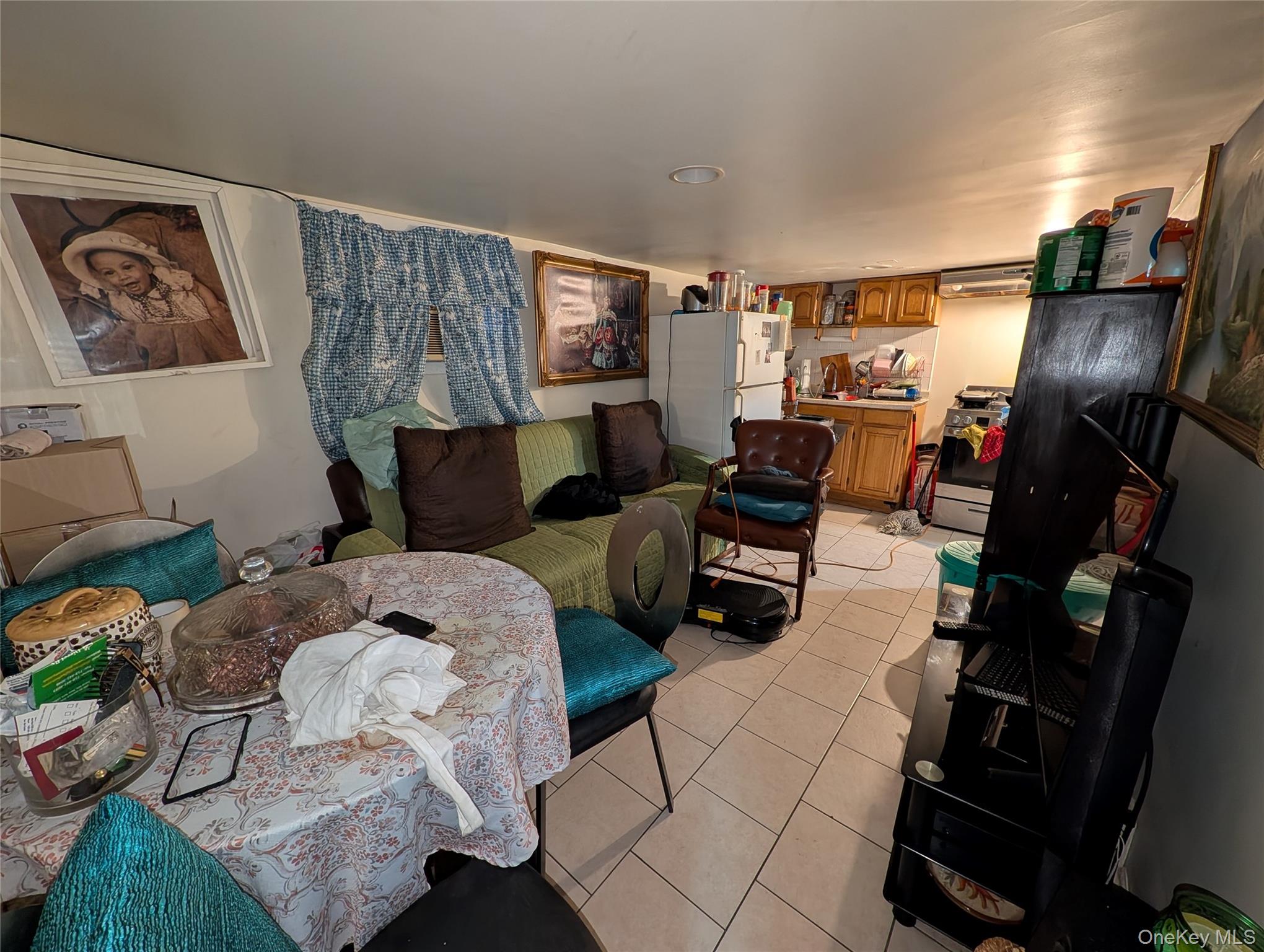 90-46 76th Street Queens, NY 11421 - Photo 24 of 32 a living room with furniture and wooden floor