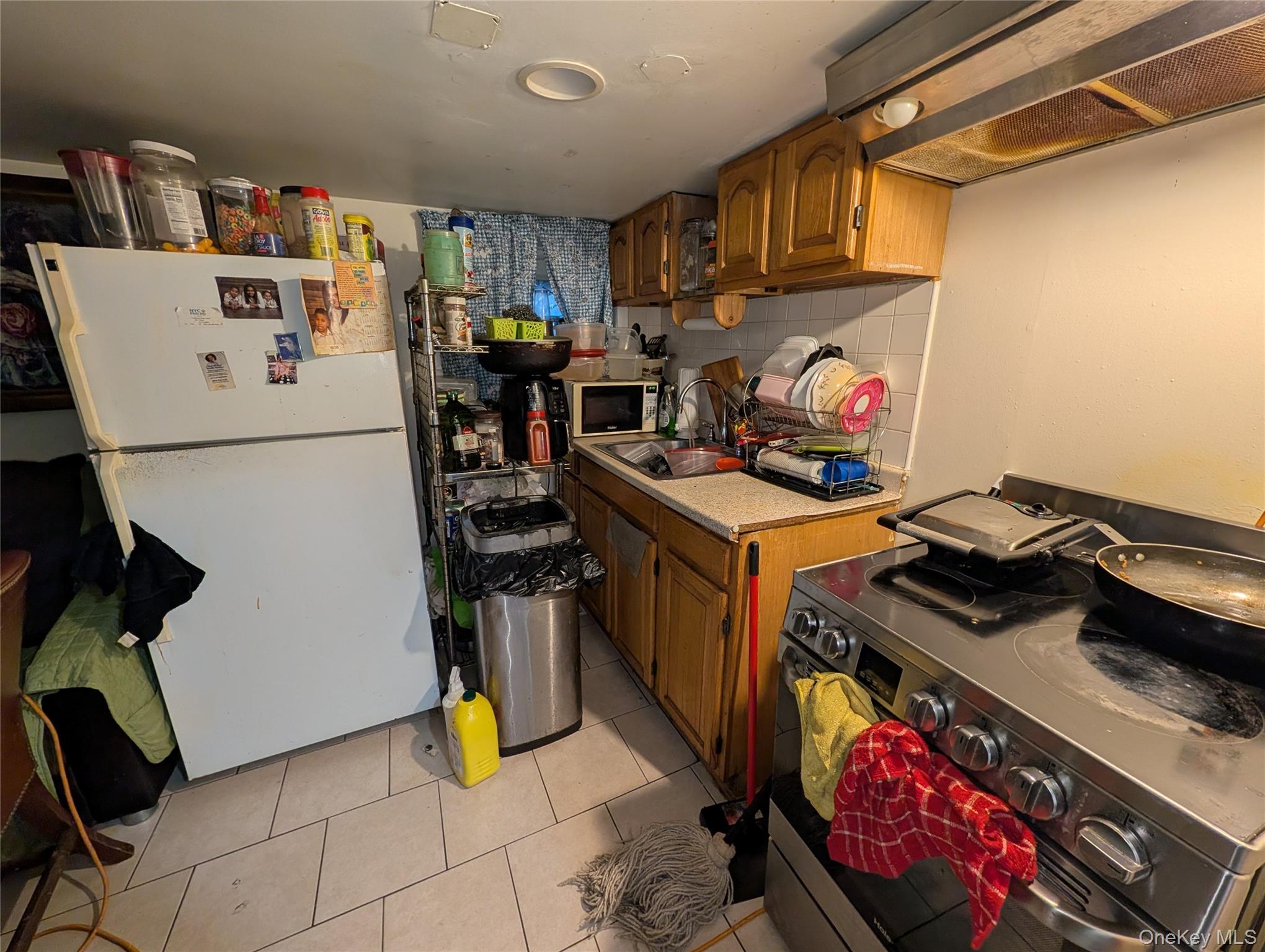 90-46 76th Street Queens, NY 11421 - Photo 25 of 32 a utility room with dryer and washer