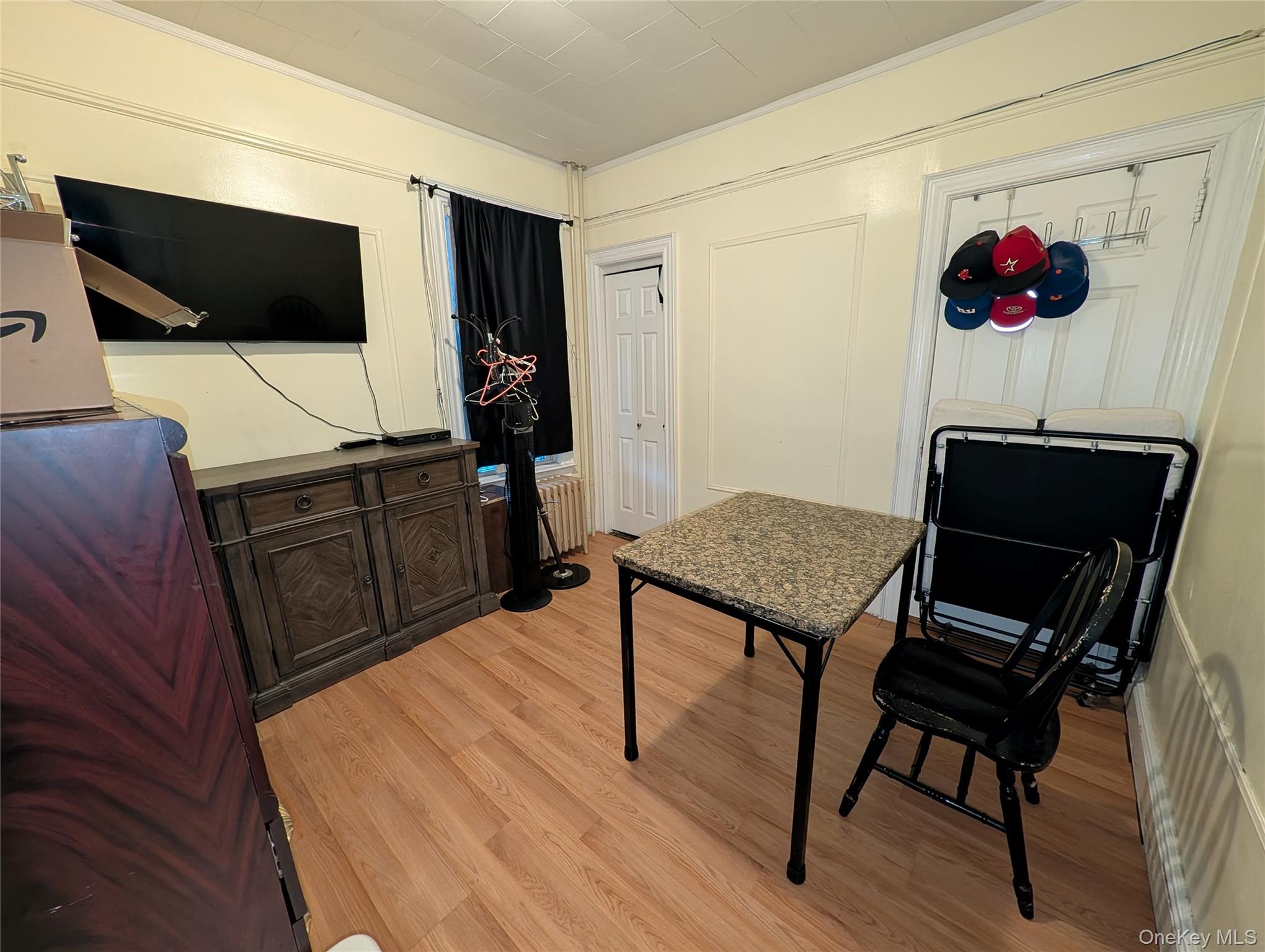 90-46 76th Street Queens, NY 11421 - Photo 7 of 32 a living room with furniture and a flat screen tv