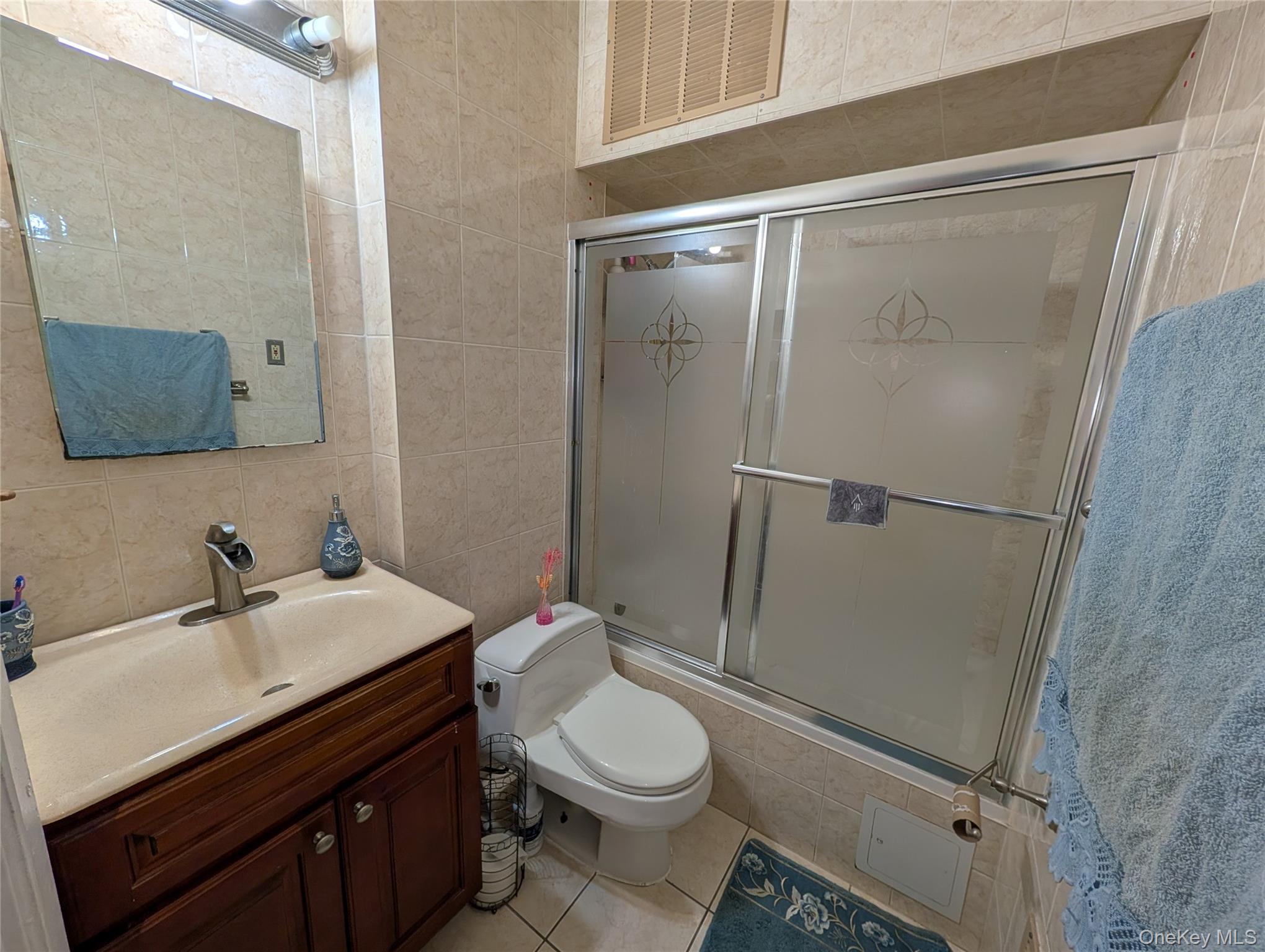 90-46 76th Street Queens, NY 11421 - Photo 10 of 32 a bathroom with a sink toilet and shower