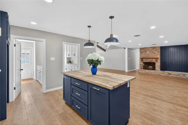 a view of an empty room with fire place