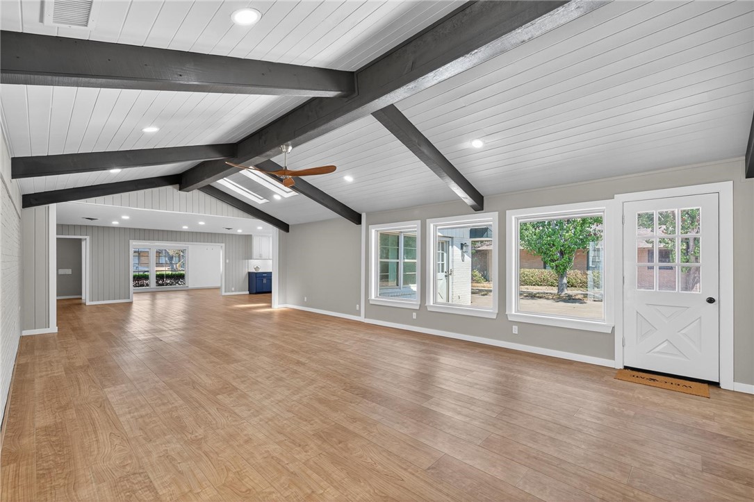 126 Rainbow Lane Corpus Christi, TX 78411 - Photo 18 of 40 a view of an empty room with wooden floor and a window