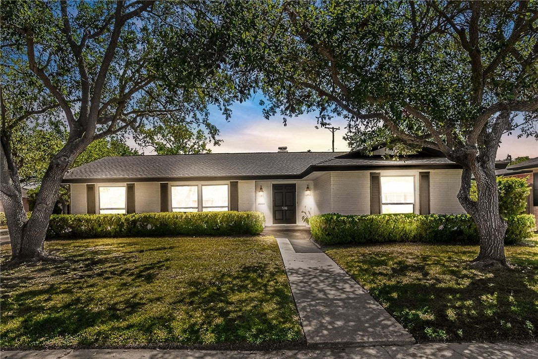 126 Rainbow Lane Corpus Christi, TX 78411 - Photo 2 of 40 a front view of a house with garden