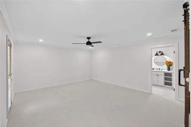 a bedroom with a balcony a bed and a couch