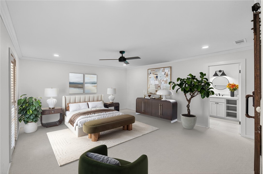 126 Rainbow Lane Corpus Christi, TX 78411 - Photo 22 of 40 a bedroom with a balcony a bed and a couch