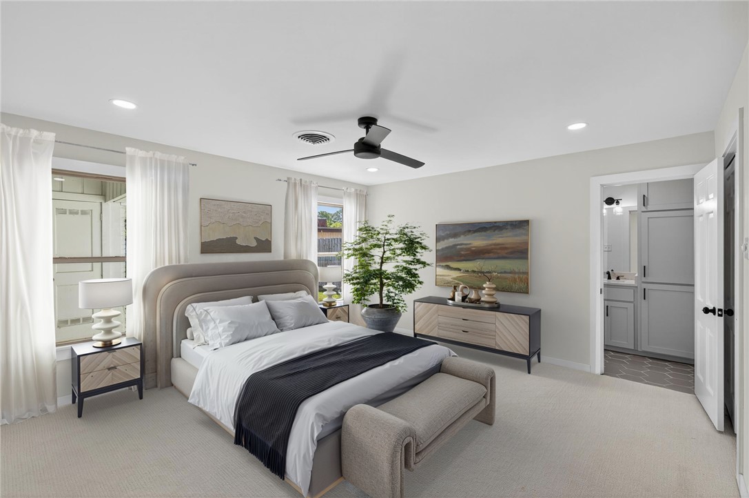 126 Rainbow Lane Corpus Christi, TX 78411 - Photo 28 of 40 a bedroom with a bed and a couch