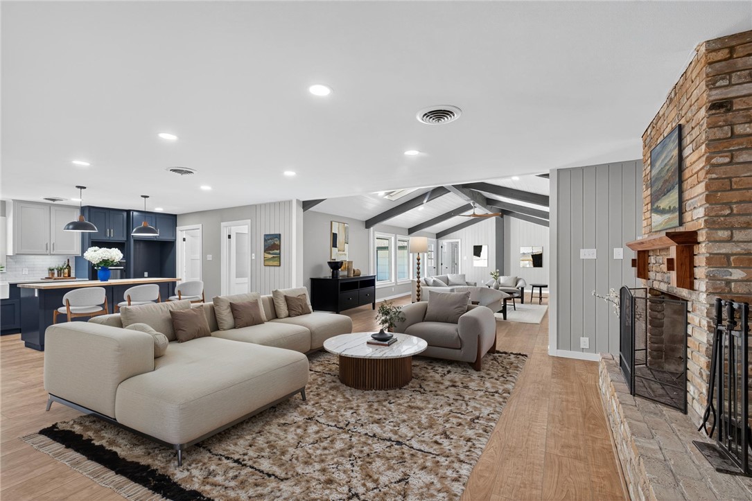 126 Rainbow Lane Corpus Christi, TX 78411 - Photo 8 of 40 a living room with furniture and a fireplace