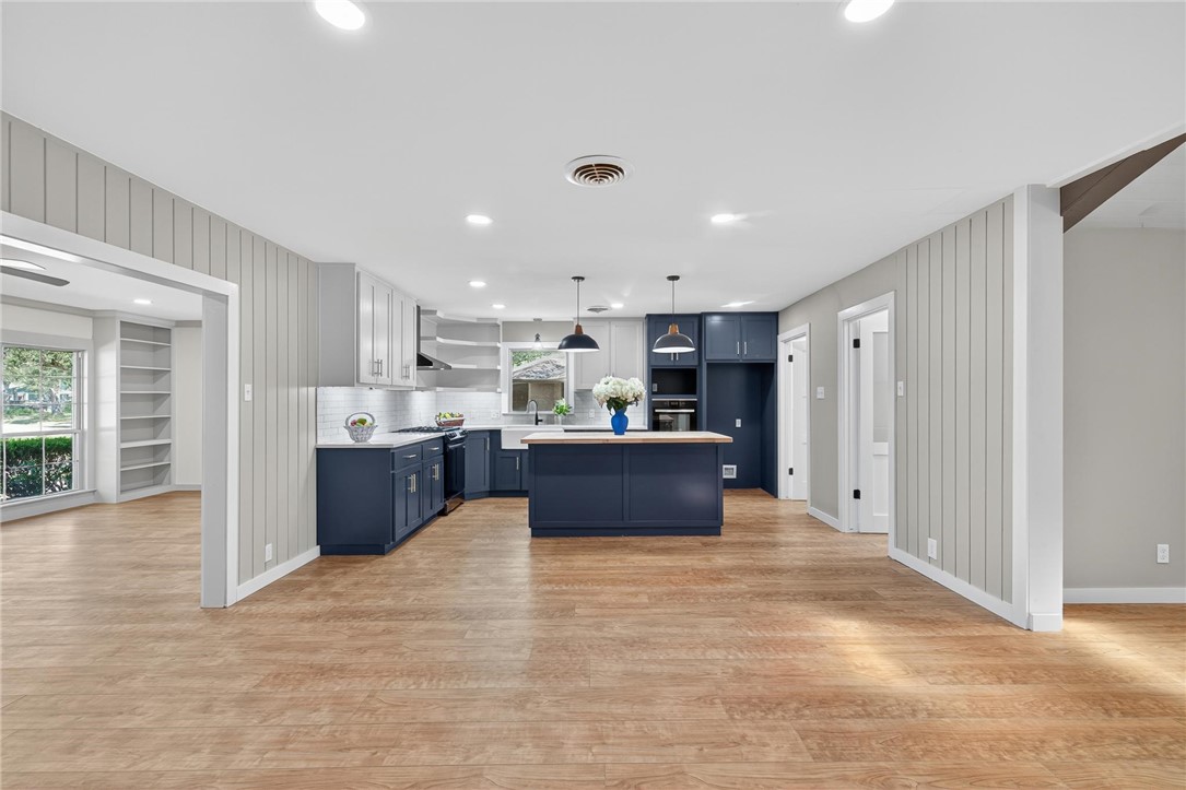 126 Rainbow Lane Corpus Christi, TX 78411 - Photo 9 of 40 a large kitchen with kitchen island a sink a stove and a refrigerator