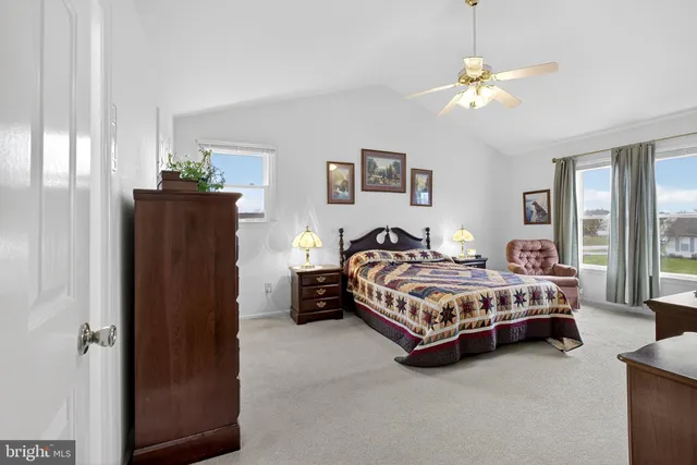 a bedroom with a bed and a table