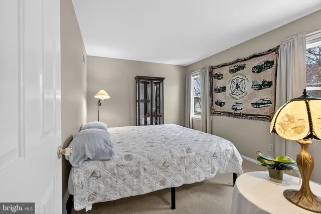 a bedroom with a bed and a cabinets