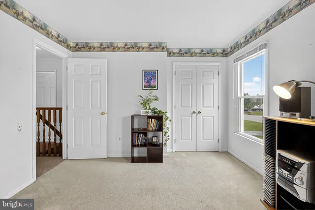a roof deck with couches and potted plants