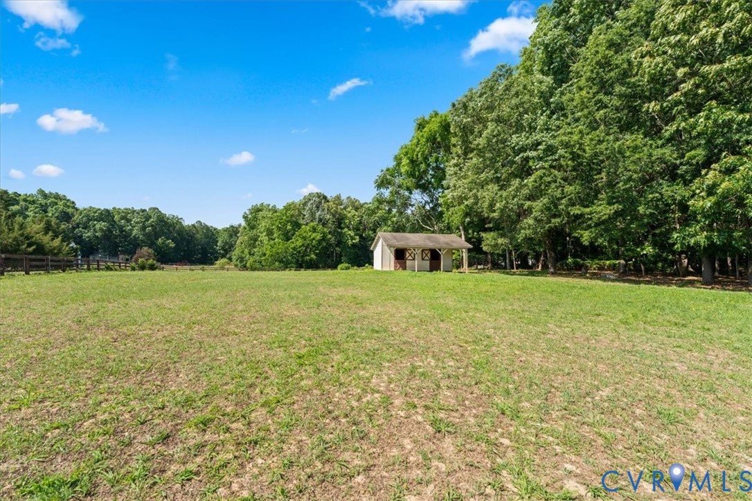3137 Trenholm Road Powhatan, VA 23139 - Photo 61 of 72 a house is sitting in middle of green field