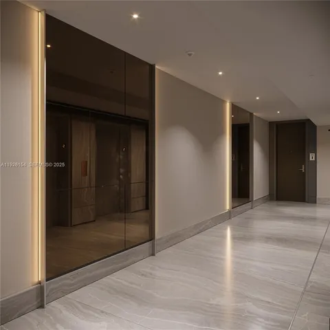 a view of hallway with wooden floor and bathroom