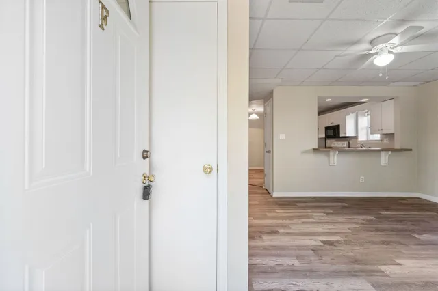 a view of a kitchen from the hallway