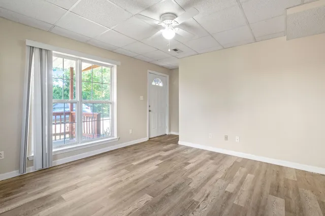 a view of an empty room with a window