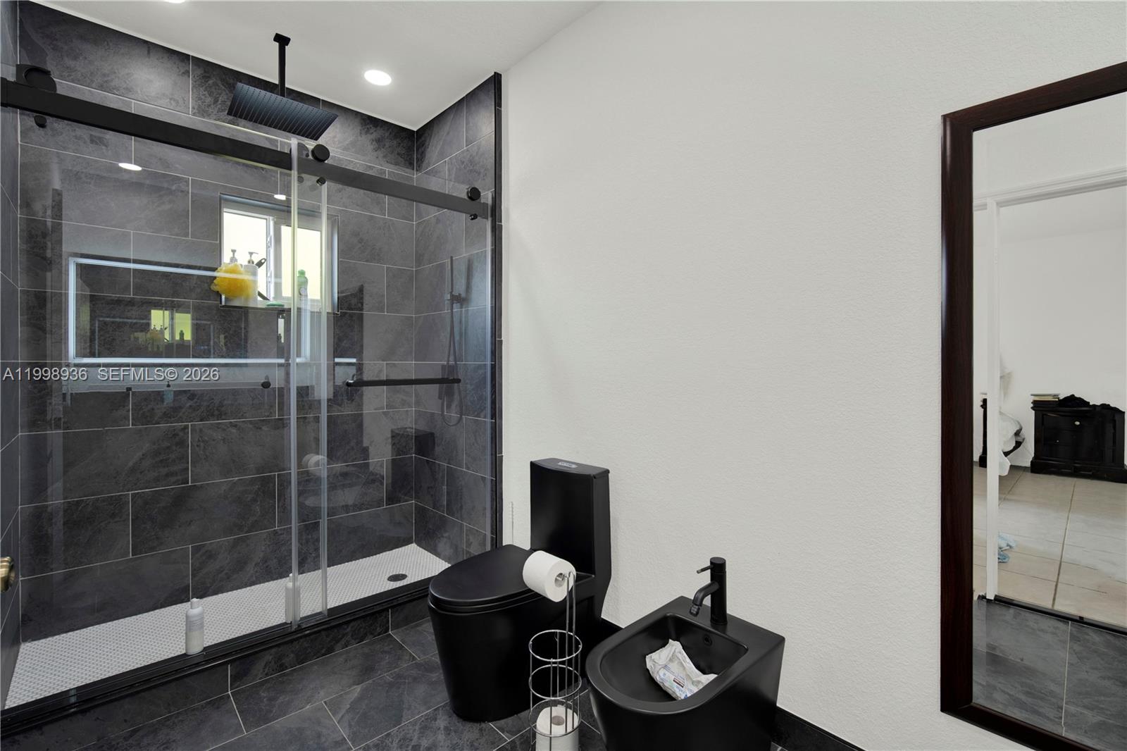 5510 Southwest 161st Place Miami, FL 33185 - Photo 14 of 28 a bathroom with a toilet and a shower