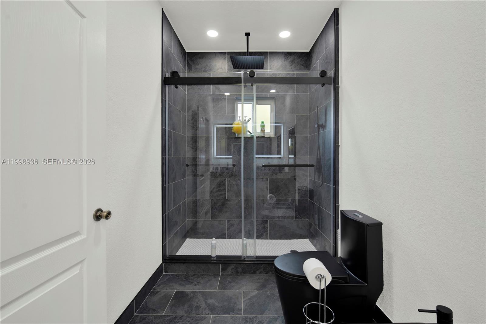 5510 Southwest 161st Place Miami, FL 33185 - Photo 15 of 28 a bathroom with a shower and toilet