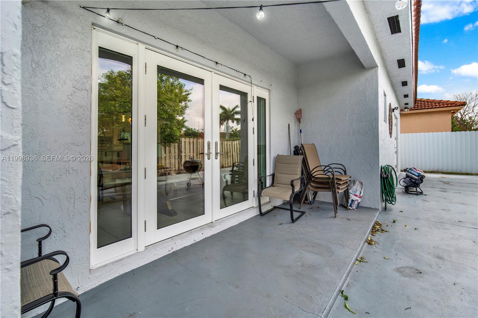 5510 Southwest 161st Place Miami, FL 33185 - Photo 22 of 28 a view of a room with gym equipment and floor to ceiling window