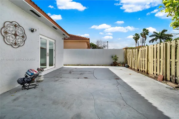 a view of a house with a backyard
