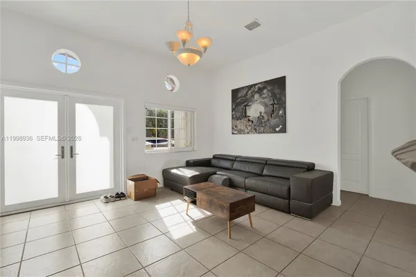 a living room with furniture and a table