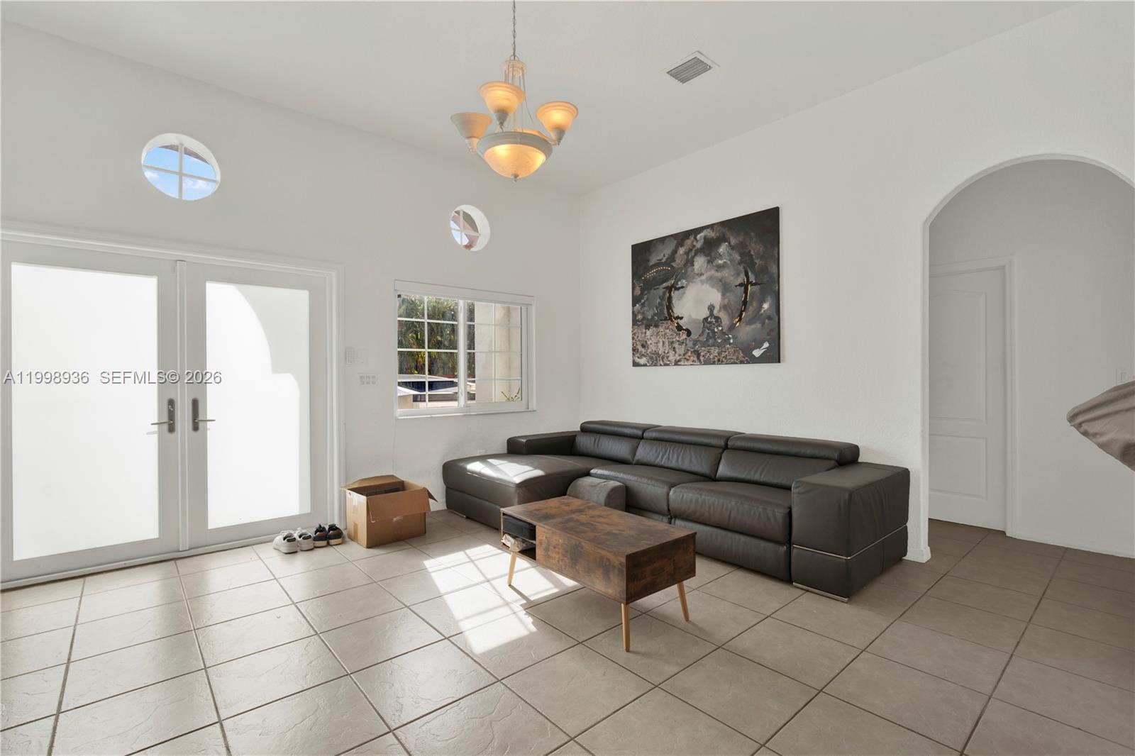 5510 Southwest 161st Place Miami, FL 33185 - Photo 28 of 28 a living room with furniture and a table