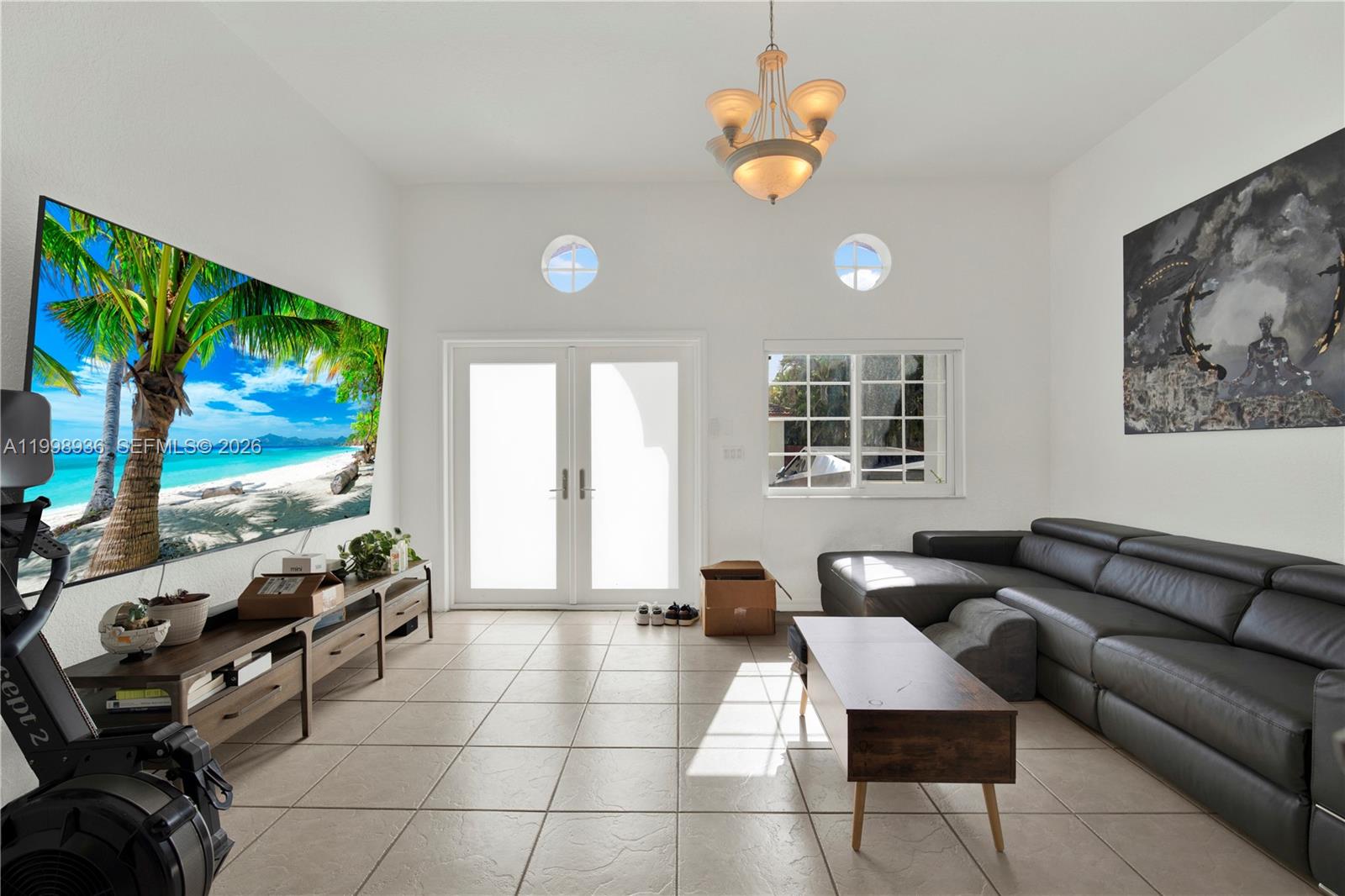 5510 Southwest 161st Place Miami, FL 33185 - Photo 3 of 28 a living room with furniture and a flat screen tv