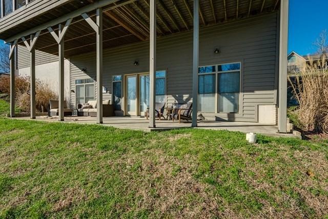 571 Mallard Pointe Road Byrdstown, TN 38549 - Photo 33 of 34 a view of a chair and table in backyard of the house