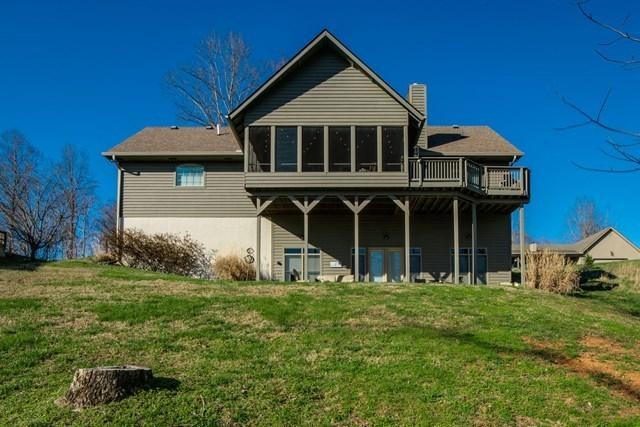 571 Mallard Pointe Road Byrdstown, TN 38549 - Photo 34 of 34 a front view of a house with garden