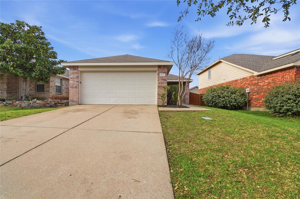 4005 Freedom Street Forney, TX 75126 - Photo 1 of 40 a view of a house with a yard