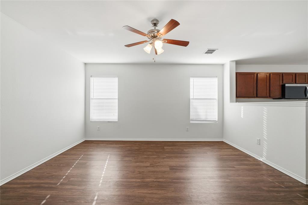 4005 Freedom Street Forney, TX 75126 - Photo 20 of 40 an empty room with wooden floor and windows