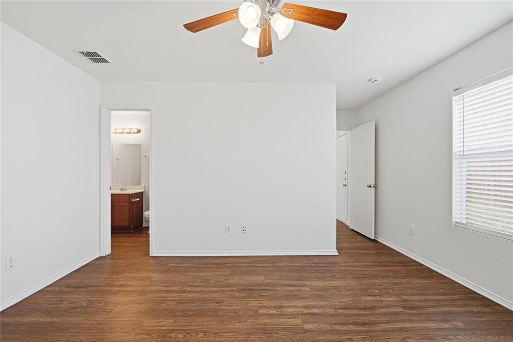 4005 Freedom Street Forney, TX 75126 - Photo 23 of 40 a view of an empty room with wooden floor and a window