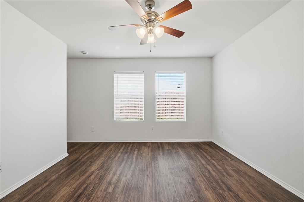 4005 Freedom Street Forney, TX 75126 - Photo 24 of 40 an empty room with a window and a ceiling fan