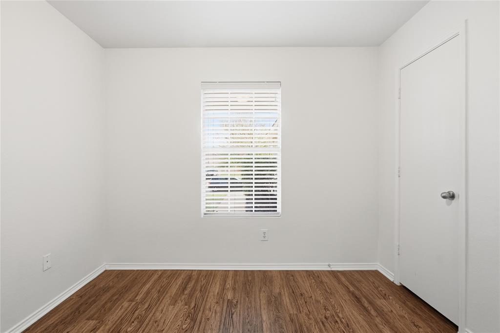 4005 Freedom Street Forney, TX 75126 - Photo 26 of 40 a view of a room that has wooden floor and white walls
