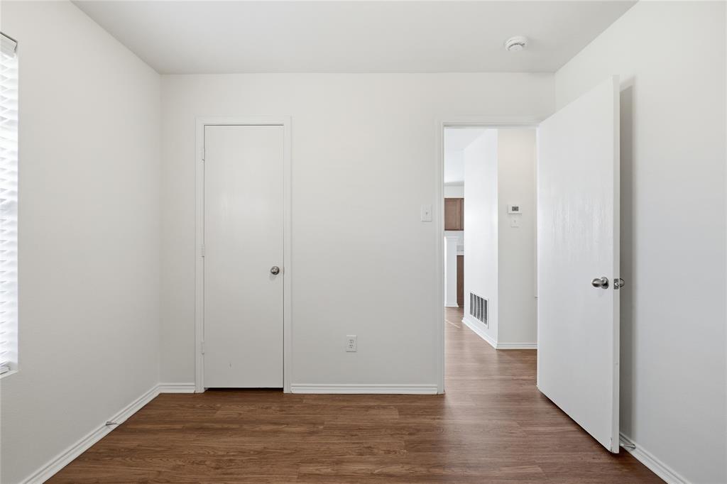 4005 Freedom Street Forney, TX 75126 - Photo 27 of 40 a view of an empty room with wooden floor