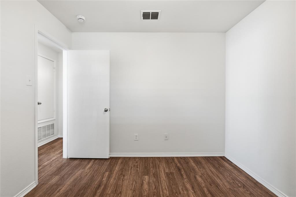 4005 Freedom Street Forney, TX 75126 - Photo 28 of 40 a view of an empty room with wooden floor