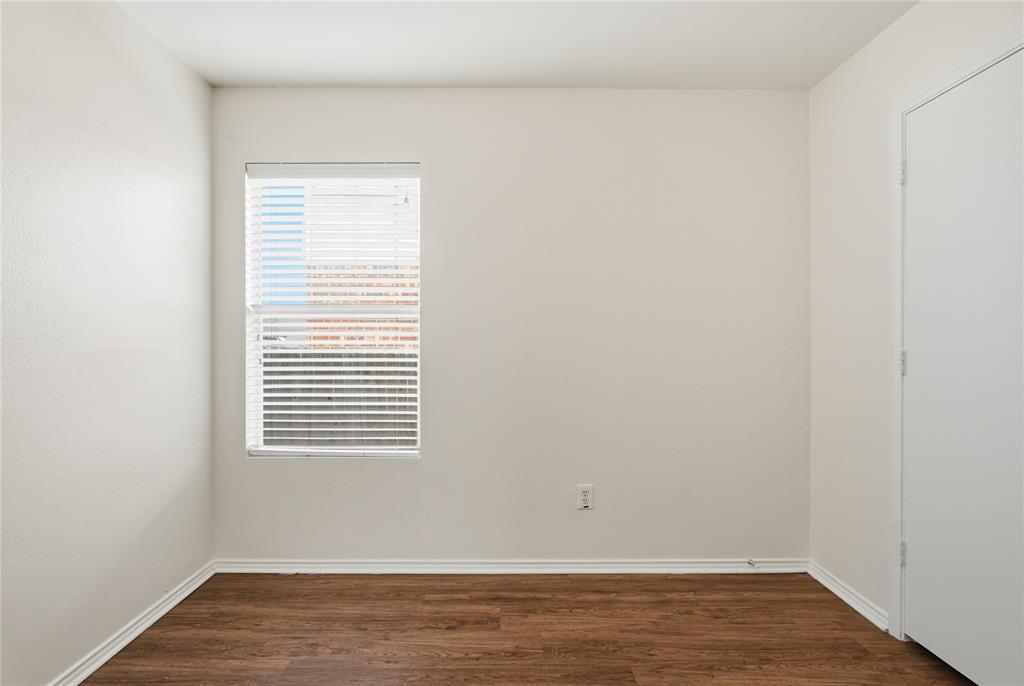 4005 Freedom Street Forney, TX 75126 - Photo 30 of 40 a view of an empty room with wooden floor and a window