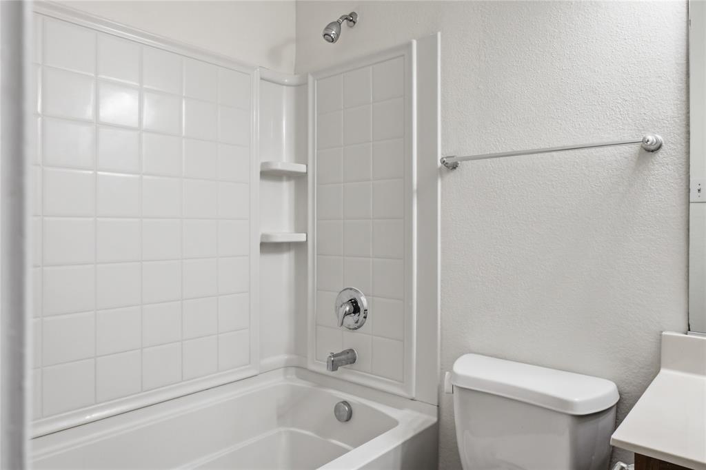 4005 Freedom Street Forney, TX 75126 - Photo 35 of 40 a bathroom with a toilet and shower