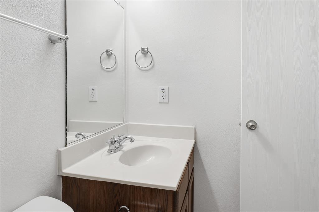 4005 Freedom Street Forney, TX 75126 - Photo 36 of 40 a bathroom with a sink and a toilet
