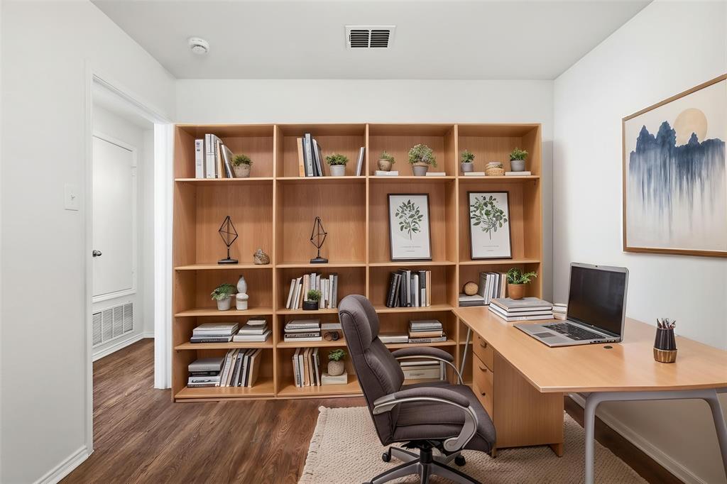 4005 Freedom Street Forney, TX 75126 - Photo 6 of 40 a view of a workspace with furniture and a bookshelf