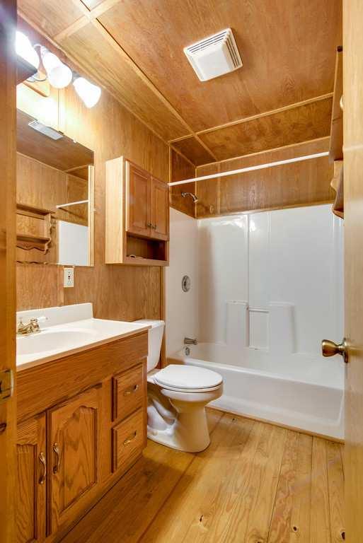 4845 Starks Road Cross Plains, TN 37049 - Photo 23 of 30 a bathroom with a sink toilet and shower