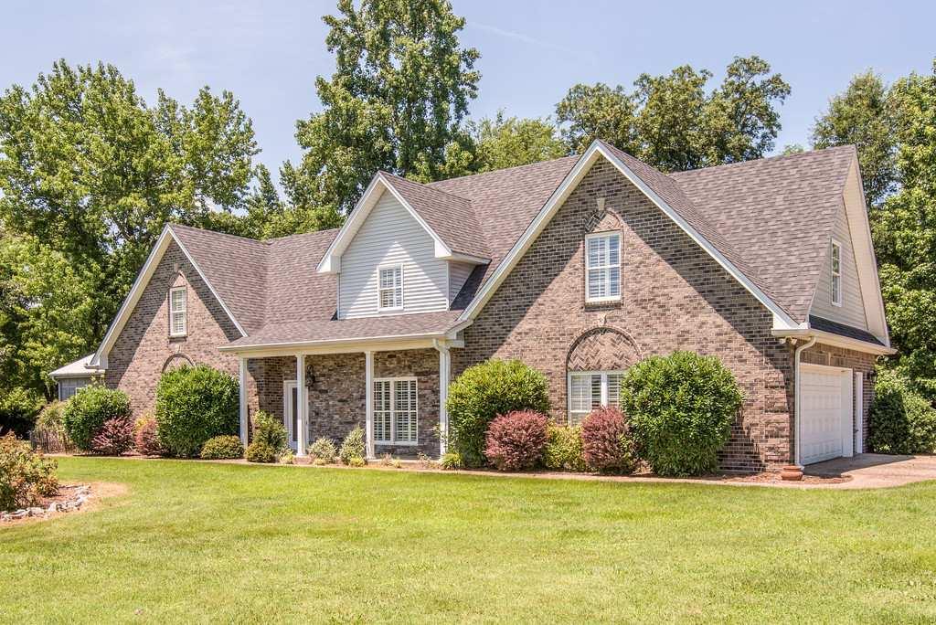 4845 Starks Road Cross Plains, TN 37049 - Photo 4 of 30 a view of a house with a yard and potted plants