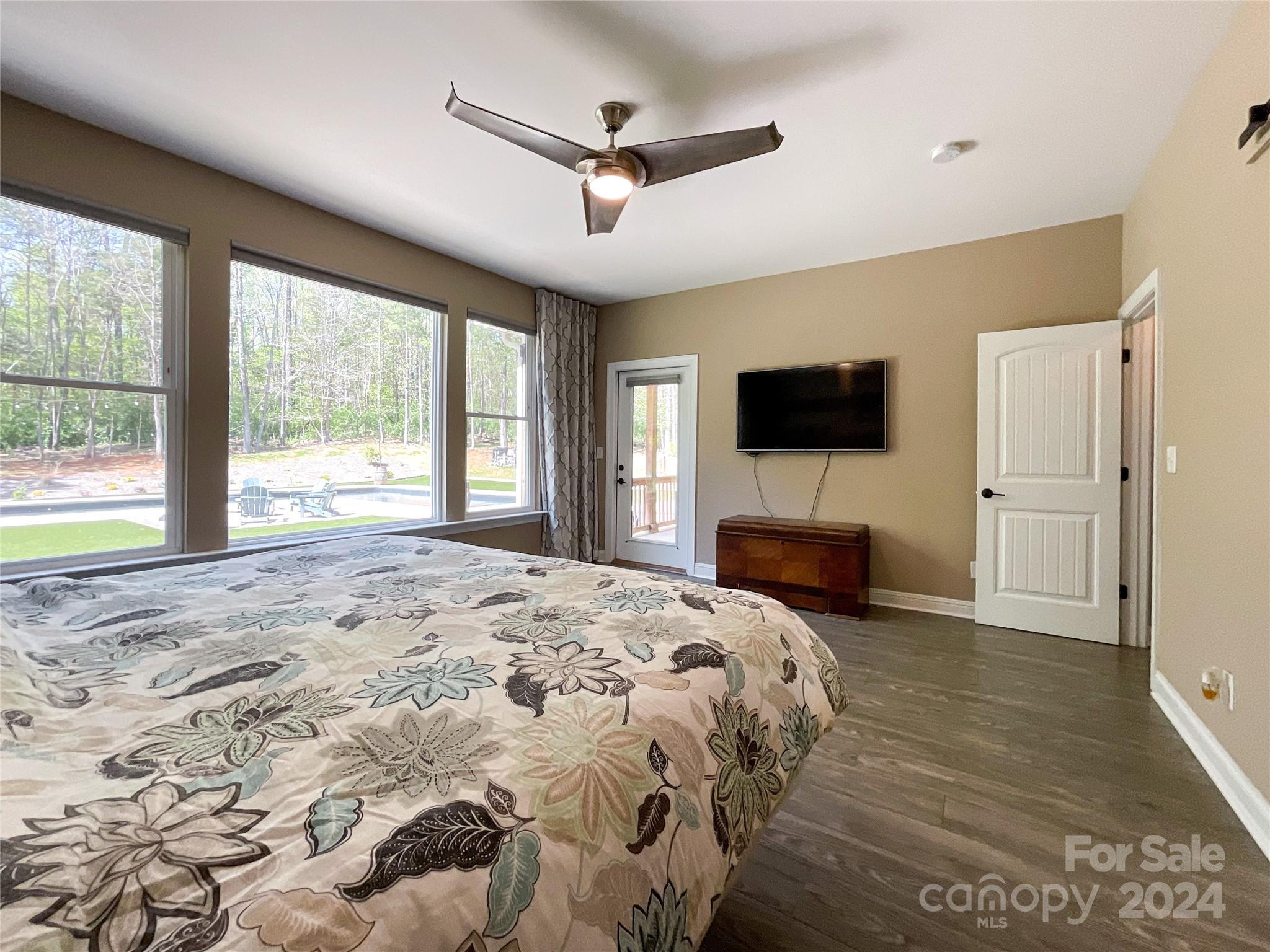 9408 Deer Run Road Waxhaw, NC 28173 - Photo 20 of 47 a bedroom with a bed and a flat screen tv