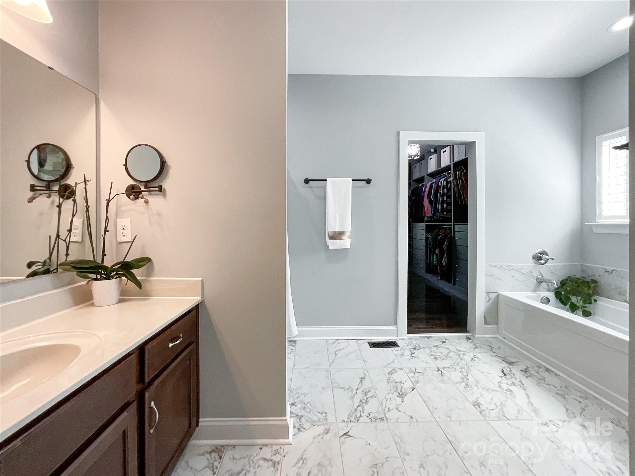 9408 Deer Run Road Waxhaw, NC 28173 - Photo 22 of 47 a bathroom with a sink and a mirror