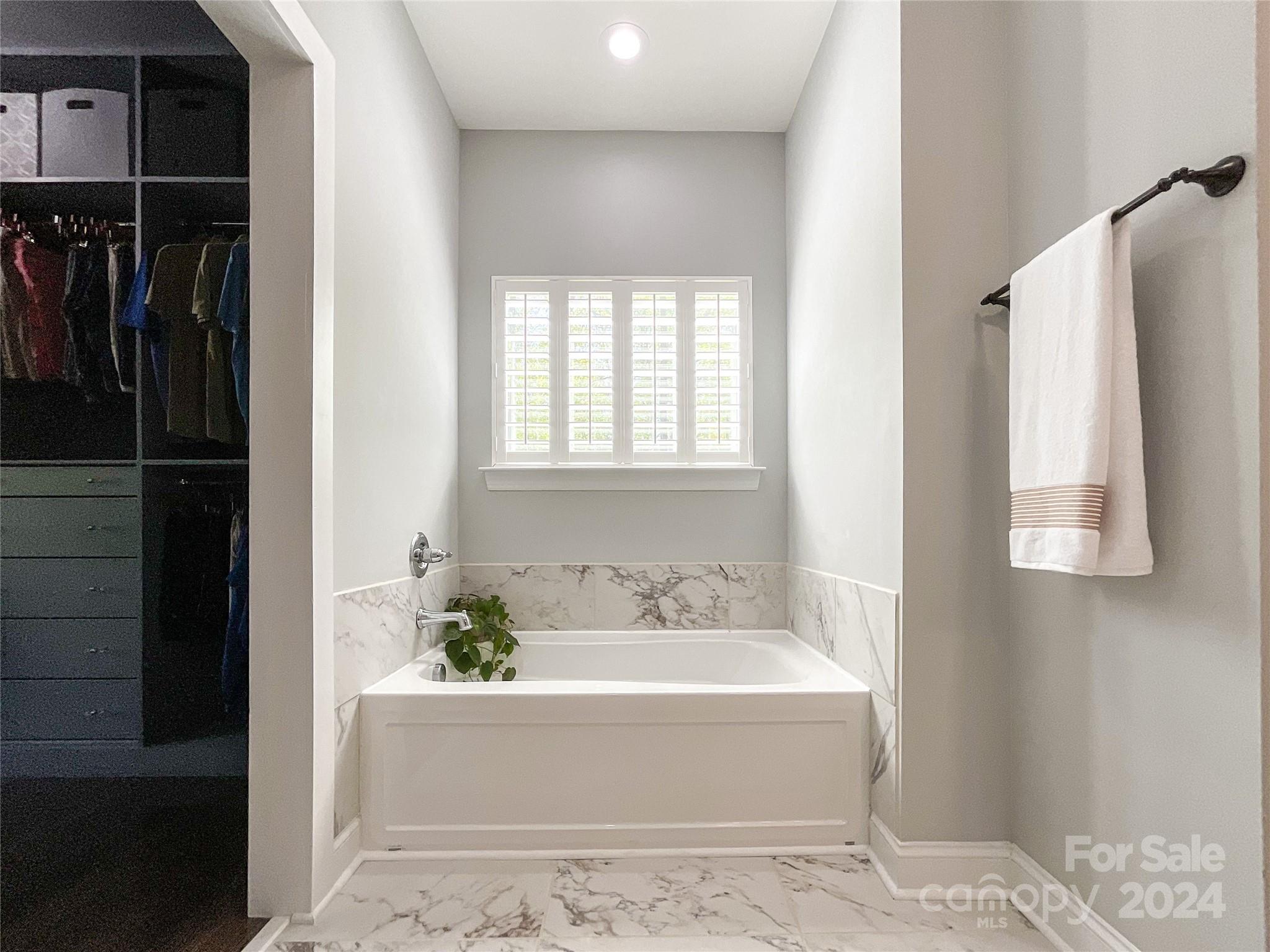9408 Deer Run Road Waxhaw, NC 28173 - Photo 23 of 47 a bathroom with a bathtub and shower