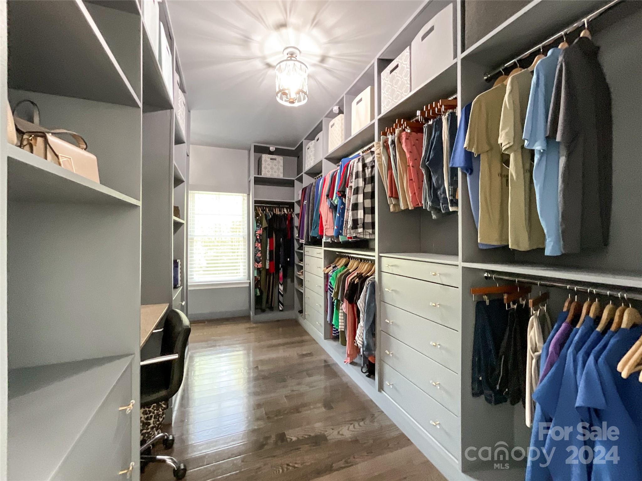 9408 Deer Run Road Waxhaw, NC 28173 - Photo 25 of 47 a view of walk in closet with clothes and shoes