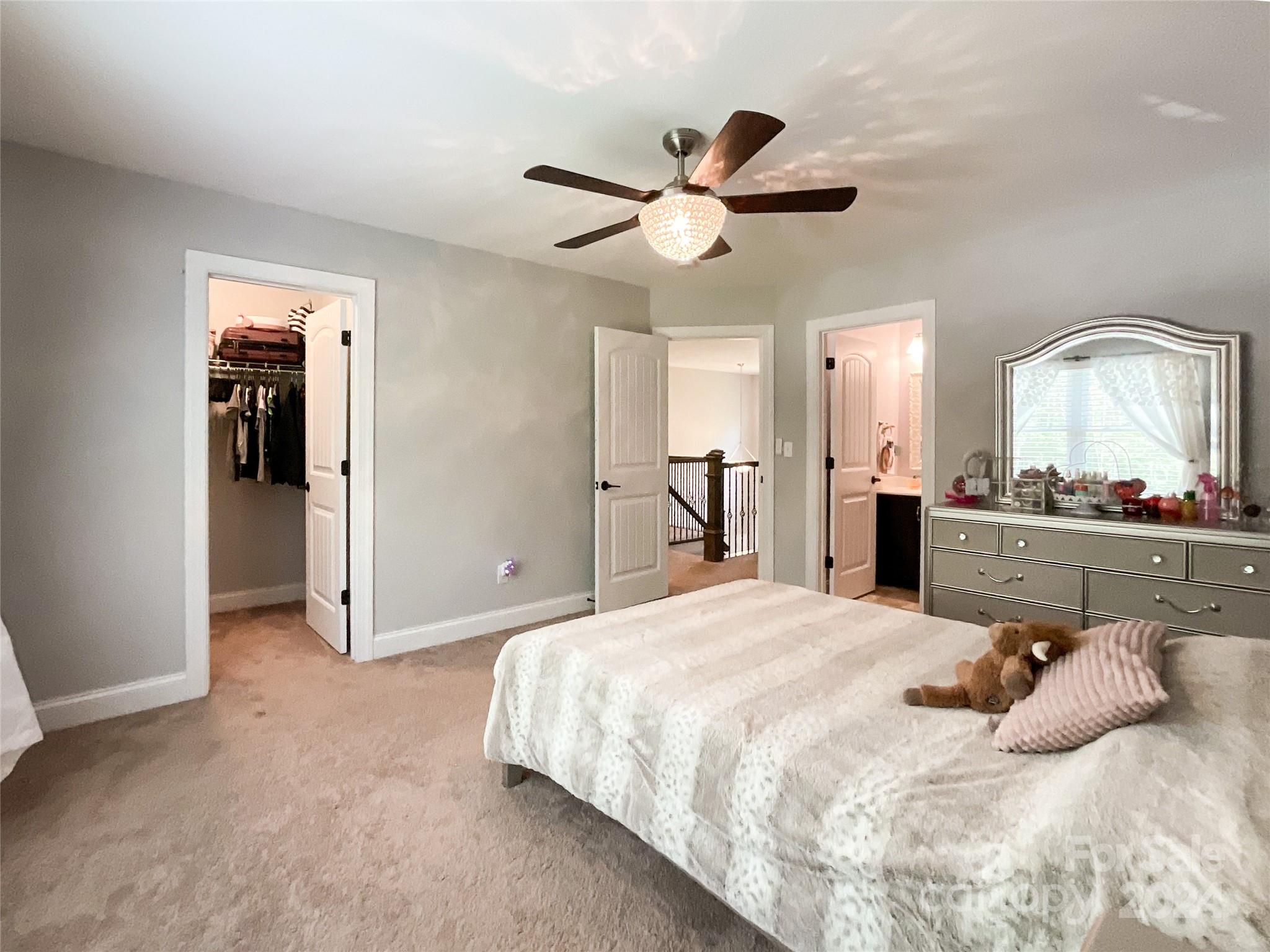9408 Deer Run Road Waxhaw, NC 28173 - Photo 31 of 47 a bedroom with a bed and a mirror