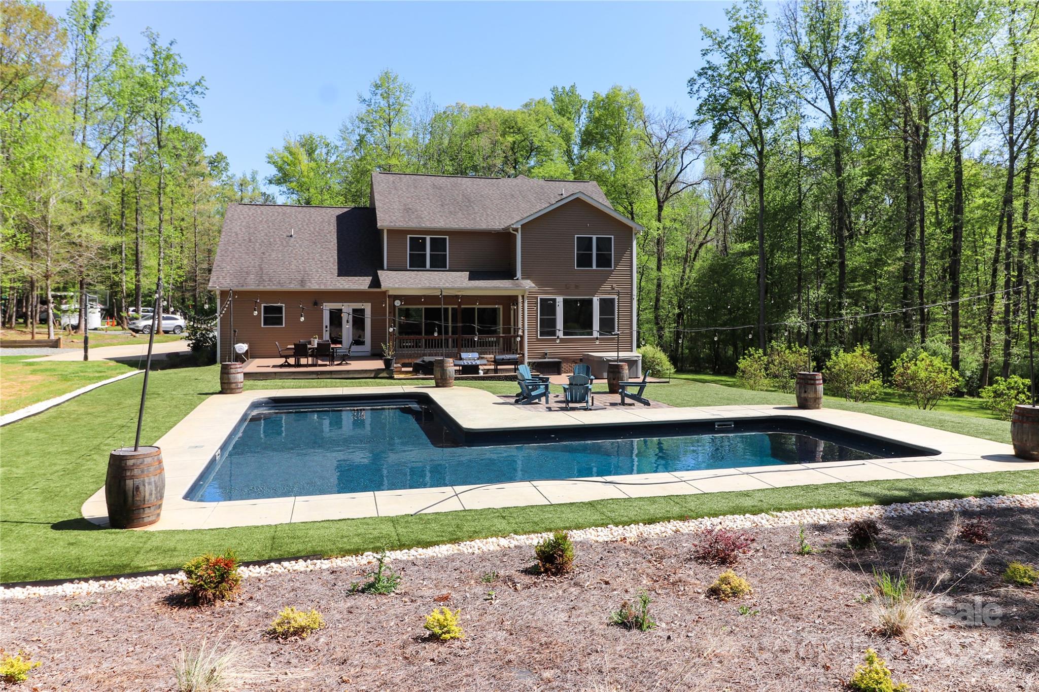 9408 Deer Run Road Waxhaw, NC 28173 - Photo 38 of 47 a front view of a house with swimming pool having outdoor seating