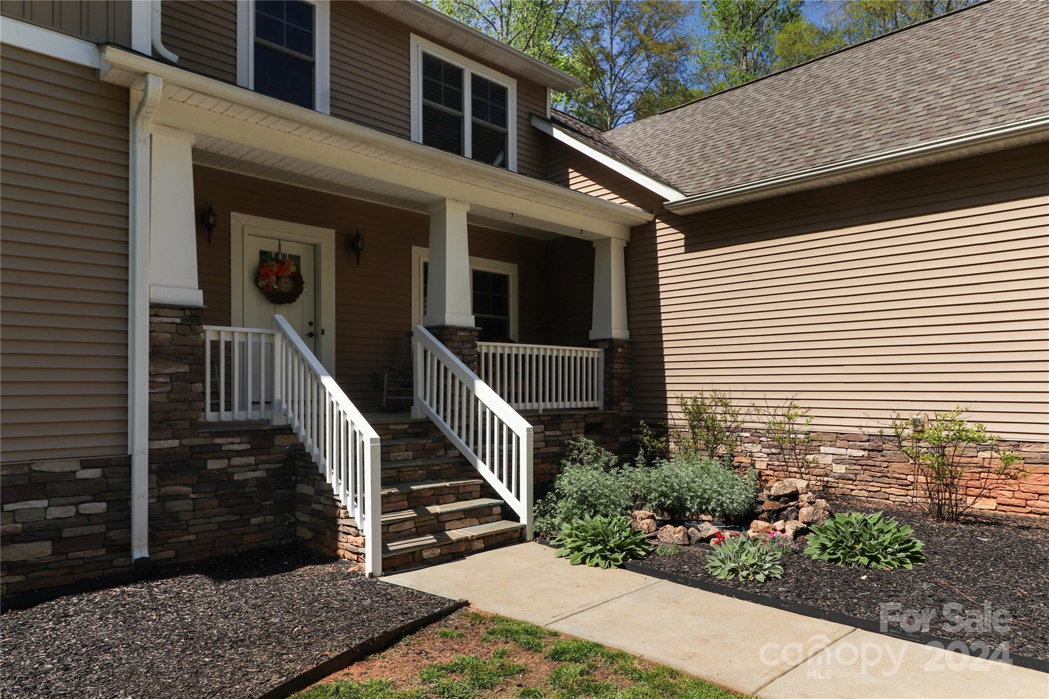 9408 Deer Run Road Waxhaw, NC 28173 - Photo 4 of 47 front view of a house with a small yard